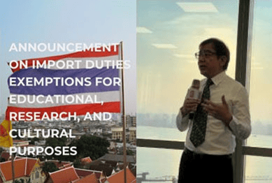 A speaker holding a microphone in front of a Thai flag and city skyline, overlaid with the seminar's import duty exemption announcement headline.